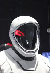 Fototapeta premium Portrait of white space suit and helmet for astronaut studio light. Empty space suit. Astronaut gear. With copy space. 