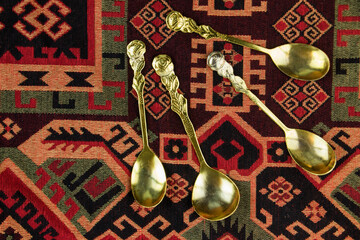 Golden spoons on the table