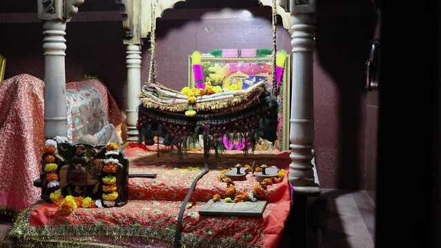hindu god lord krishna at swing at temple from flat angle