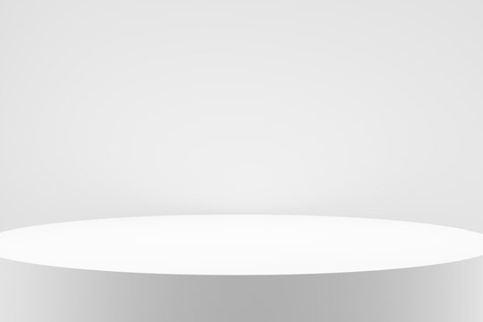 Modern empty round white circle podium, platform or pedestal against white wall. © Cagkan