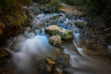 Crystal clear waters photographed with long exposure in the surroundings of the Salto del Usero in the Mula river, Bullas, Murcia, Spain