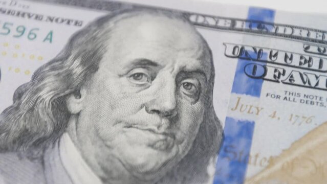 US currency featuring Benjamin Franklin, symbolizing the success and wealth achieved through business investments and smart financial management.