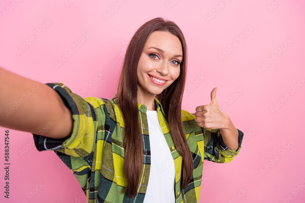 Wall mural Portrait of gorgeous person make selfie toothy smile demonstrate thumb up isolated on pink color background