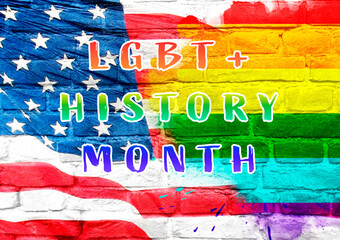 text on brick wall LGBT History Month
