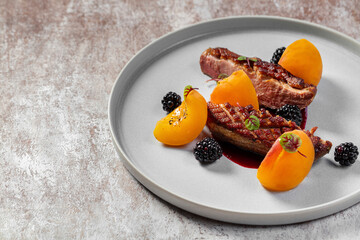 Duck breast with blackberries and peaches