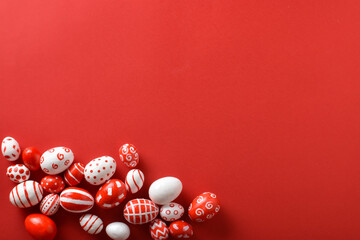 Easter backgrounds, scattered Easter red and white eggs on a bright red background.