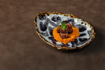 Veal cheeks with pumpkin puree