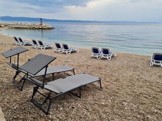lounge chairs on the beach. beach in the morning time	