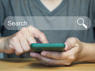 information search technology. Active man searching through smartphone on window. Digital