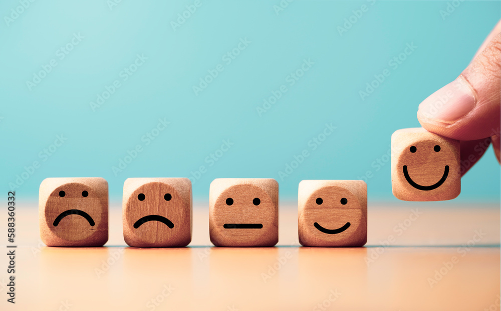 Poster customer satisfaction survey concept, businessman putting smile face icon which print screen on wood