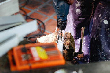 Obraz premium Image of Metalworker working on a drilling machine