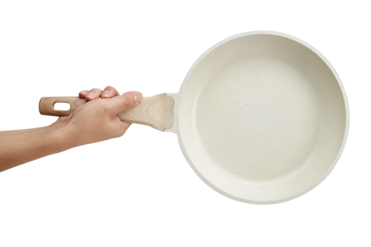 Hand holding a ceramic frying pan isolated on white background. Studio shot