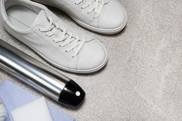White leather shoe cleaning kit - water-repellent spray, foam, rag and sponge, copy space, place for text