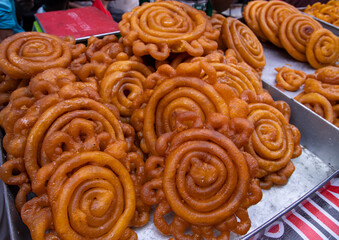 Delicious Testy sweet fried jalebi showing for sale on a street food market in the Chakbazar, Dhaka-Bangladesh