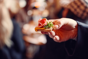 a person holding a piece of food in their hand