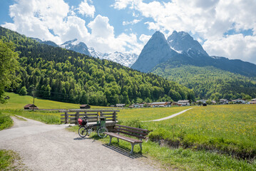 resting place with bench, bike tour from Garmisch to Grainau at springtime, landscape upper bavaria