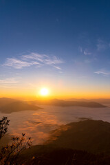Landscape of the mountain and sea of mist in winter gold sunrise view from top of Phu Chi Dao mountain , Chiang Rai, Thailand
