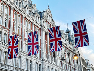 Regent Street with Union Jack Flags in London, United Kingdom UK - obrazy, fototapety, plakaty