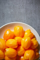 Fresh sweet marian plum on background