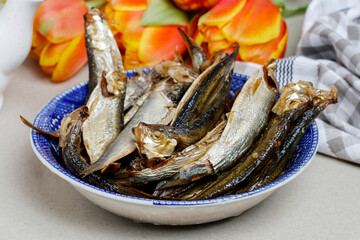 Smoked sprats in a bowl.