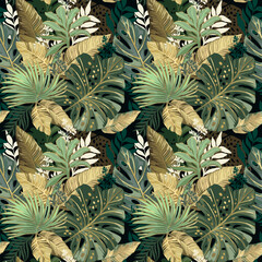 Golden tropical leaves on a black background. Seamless pattern.  - 588381593