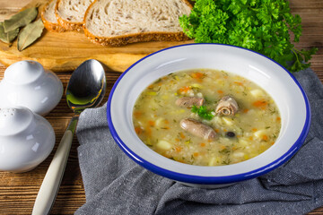 Polish barley soup with vegetables and chicken heart.