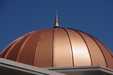 Copper dome roof and blue sky - Powered by Adobe