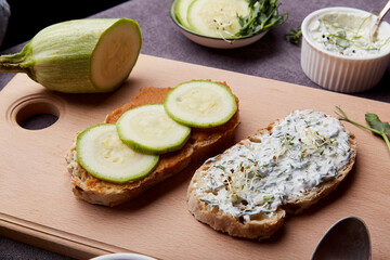 Vegetarian healthy breakfast - sandwiches with zucchini spread, alfalfa, sprouted peas, garlic sauce. Low in calories, FODMAP, Keto diet