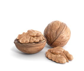 Shelled and cracked walnuts close-up isolated on white background  - 588385307