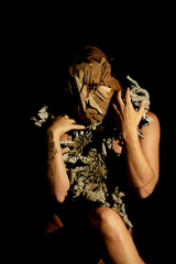 Woman with a mask carnival masquerade dark makeup body paint face 