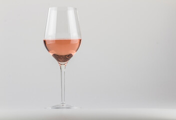 GLASS OF WINE ON A NEUTRAL BACKGROUND