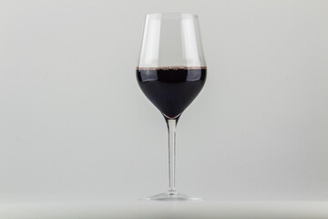 GLASS OF WINE ON A NEUTRAL BACKGROUND