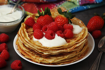 Russian cuisine national dish bliny with fresh berries