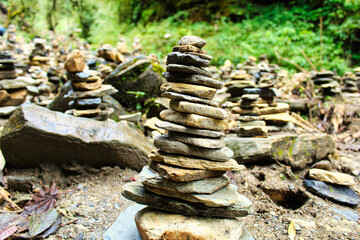 Fototapeta na wymiar A Stone Cairn is a common sign in rivers across Nepal as a symbol of good spirits and safe passage through the valleys and passes
