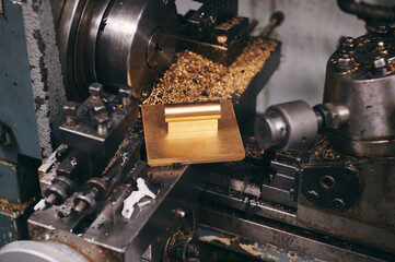 a close up of a machine cutting a piece of wood