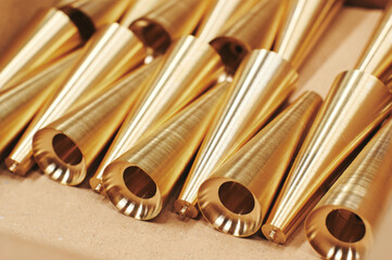 a bunch of brass pipes lined up on a table