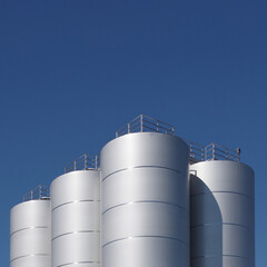 Industrial silos under blue sky