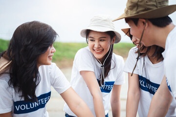 Group of asian teenage friends diverse people volunteer teamwork joining charity event to cleaning up garbage on public area ,Unity and team spirit on world environment day.