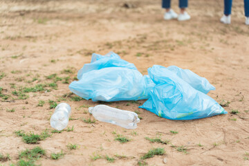 Close up on garbage bag for cleaning beach area in charity event earth day, Volunteer work in environment conservation.