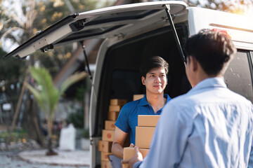 Home delivery service and working service mind. Man customer hand receiving a cardboard boxes parcel from delivery service courier. delivery logistic concept