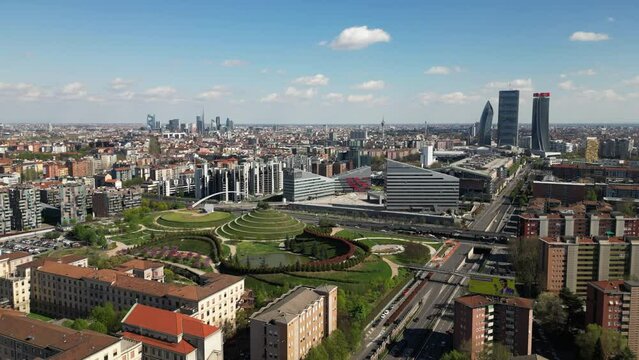 Italy , Milan 2023 - drone aerial view from Montagnetta di San Siro of downtown  with Citylife district , Garibaldi  square and Portello new modern area of the city - tourist attraction sightseeing