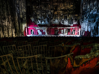 Abandoned and burned cinema hall in an old multiplex cinema