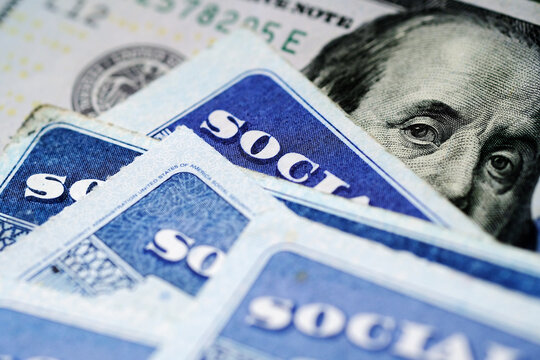 Social Security Cards with US One Hundred Dollar Bill $100