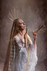 Goddess of fate moira with scissors is preparing to cut the thread of life. Ancient mythology