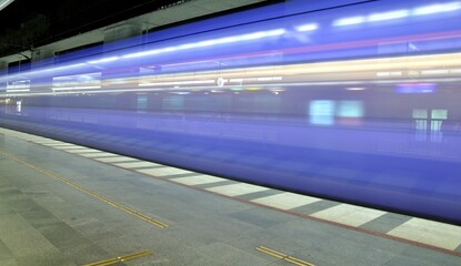 A moving train in a train station, South of Sweden.