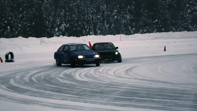 car hits a snowdrift, winter drift, winter racing, professional drift, car on ice, slow motion