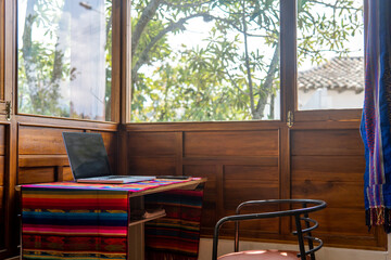 Workspace with a laptop in a cottage