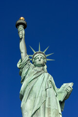 Fototapeta na wymiar close up of Statue of Liberty, blue sky 