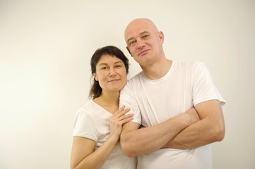 Happy smiling senior couple standing together on white background. High quality photo