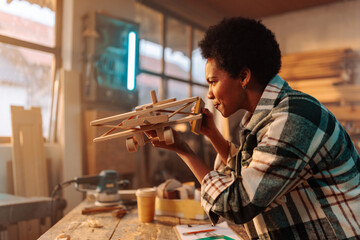 Happy entrepreneur in wood workshop